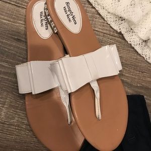 Simply Vera Wang white patten leather flip flops.